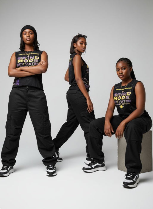 Three women wearing black outfits with text on a white background