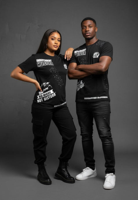 Two people wearing black t-shirts with text on a gray background