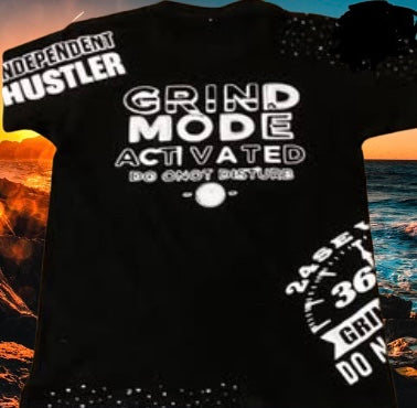 Black t-shirt with motivational text against a scenic background